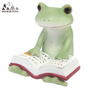 Ornament Copeau Frog reads a book