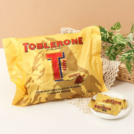Toblerone トブラローネ タイニーミルクバッグ 0g チョコレート の商品ページ 卸 仕入れサイト スーパーデリバリー Toblerone トブラローネ タイニーミルクバッグ 0g チョコレート の商品ページ 卸 仕入れサイト スーパーデリバリー